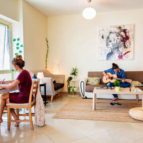 wolfcreek-condos-students-working-in-living-room wolfcreek-condos-students-working-in-living-room